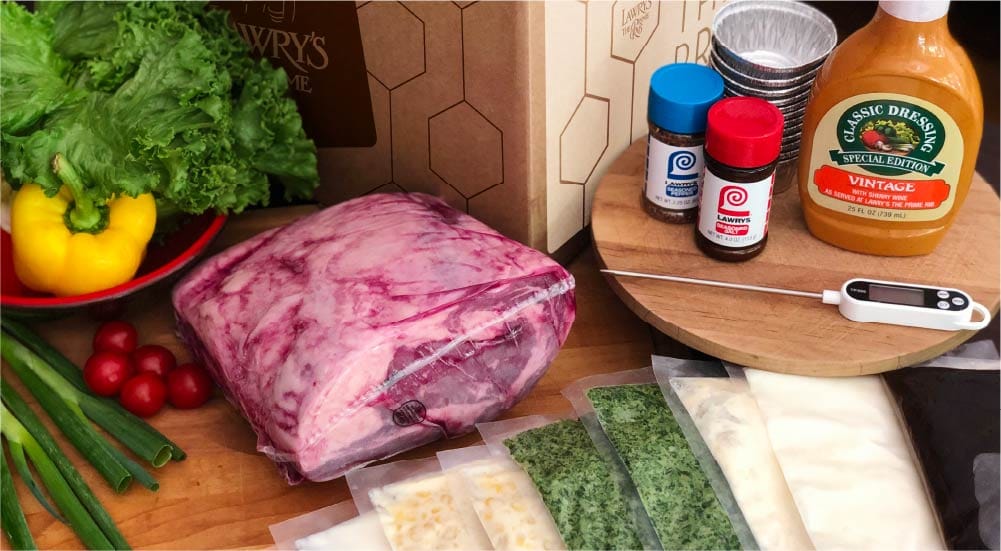 unboxed contents of a Lawry's At Home shipment, including prime rib and all the sides